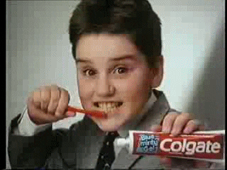 retro brush colgate brushing teeth GIF