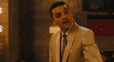 Movie gif. Oscar Isaac as Blue Jones in Sucker Punch tilts his head down and lifts an eyebrow up as he points at someone.