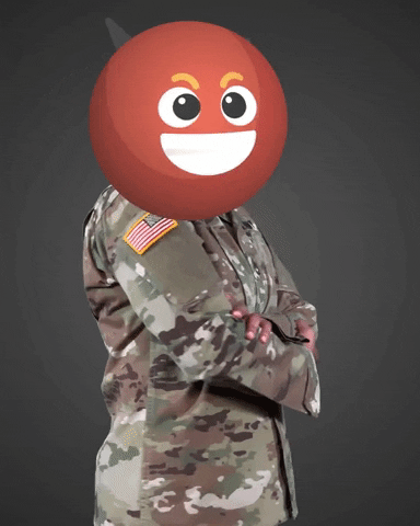 Video gif. A Devil emoji covers the face of someone dressed in a U.S. Army uniform. The devil emoji nods its head like it’s laughing evilly. The body has their arms folded and it turns to face us. 