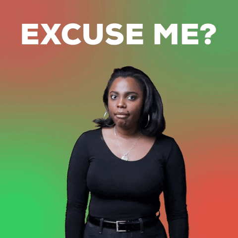 Video gif. Realtor Hope Sinclair tilts her head and gestures to the side with a hand, giving us wide eyes like she's drawing your attention to someone irritating or embarrassing. Text, "Excuse me?'