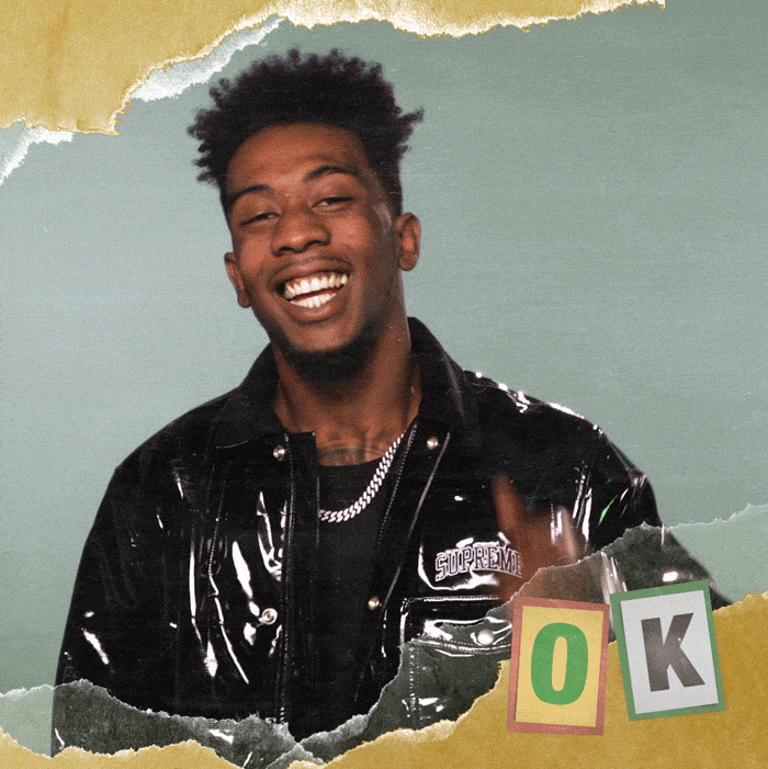 Celebrity gif. Desiigner grins and points up, flashing us an "Ok" sign with his hand. Text, "Ok."