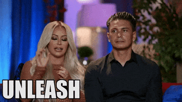 Reality TV gif. In a scene from Marriage Boot Camp, Pauly D sits next to Aubrey O'Day, who plainly tells us to: Text, "Unleash the beast."