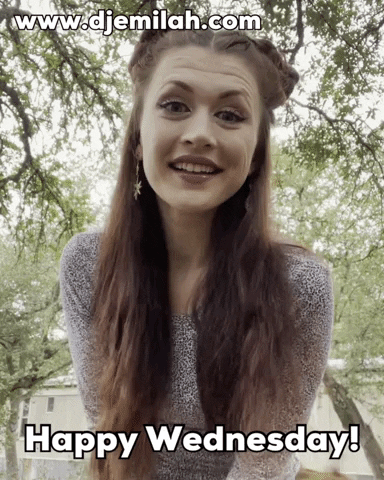 Video gif. A woman with long fairly-like hair hops back and says, "Happy Wednesday."