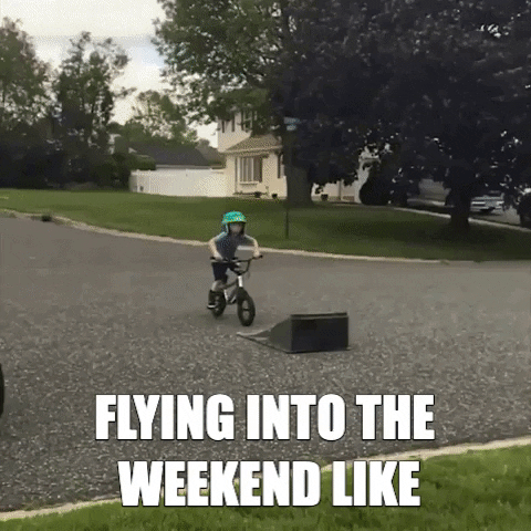 Video gif. A little boy gets big air from riding up a bike ramp and lands on a grassy lawn. Text, "flying into the weekend like."