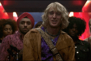 Movie gif. Owen Wilson as Hansel from Zoolander standing in front of his crew of male models throws his hands up in disbelief and says, “Whatever dude. Whatever. Peace out and God bless.”