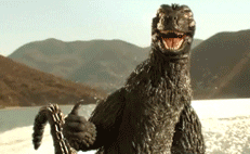 Video gif. Godzilla water skiis on a lake. He looks at us with a big smile and holds a thumbs up.