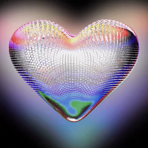 Digital art gif. A heart-shaped disco ball rotates in a circle, reflecting a rainbow of colors.