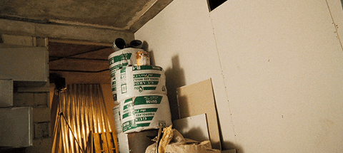 man going through a dry wall