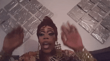 Celebrity gif. Jasmine Masters wears large gold, dangling earrings and bracelets as he puts his hands up with a look of annoyance and says, "I'm done."