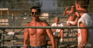 Movie gif. Playing beach volleyball, Tom Cruise as Pete in Top Gun high-fives Anthony Edwards as Goose, and then Goose runs back holding the ball and hooking Val Kilmer as Tom in his elbow.
