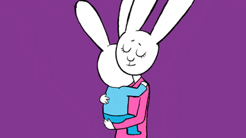 Cartoon gif. Held in his mother's arms, Simon from Simon Super Rabbit leans back and they smile at each other, then return to the hug.