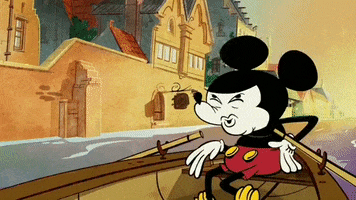 Disney gif. Mickey Mouse's head is stretched into a detailed shocked expression and exaggerates that his mind is blown with an explosion animation around his head and holds up his hand to his mouth.
