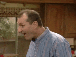TV gif. Ed O’Neill as al Bundy on Married with Children swings his head around with bulging eyes as he nods his head. He then lifts one eyebrow and bites his lip as he tries to think about what had just happened for a moment,