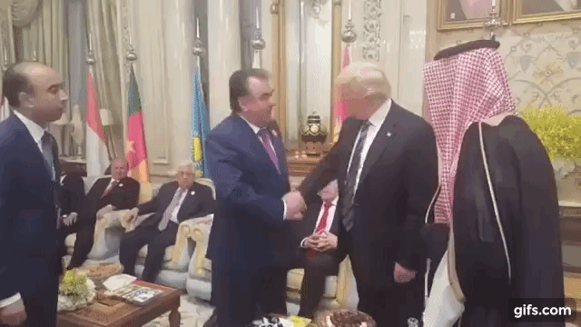 Image result for trump awkward handshake long gifs macron