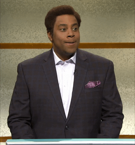 SNL gif. Wearing a suit, an angry Kenan Thompson holds back a smile and yells, “STOP IT.”