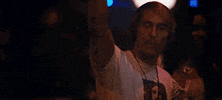 Movie gif. Matthew McConaughey as Wooderson in Dazed and Confused, with his arm raised, then lets his arm fall, pointing his finger. The image freezes here and text appears, "this."