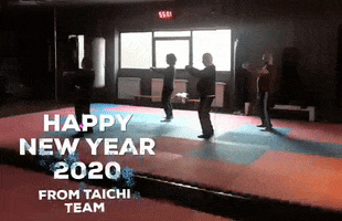 Photo gif. Four people perform a tai chi pose in a gym with the text, “Happy New Year 2020 from tai chi team.”