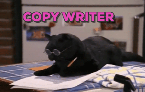 cat writing GIF