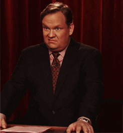 TV gif. Andy Richter on Conan is making taunting expressions with his face, looking petty and immature.