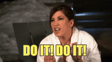 Reality TV gif. Jacqueline Laurita on Real Housewives of New Jersey wears a bathrobe and clenches her fists as she forcefully shouts, "Do it! Do it!"