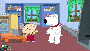 TV gif. Stewie Griffin in Family Guy stands near Brian the white dog and they jump in unison and give an excited high five.