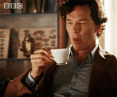 TV gif. Benedict Cumberbatch as Sherlock Holmes takes a sip of tea, considering.