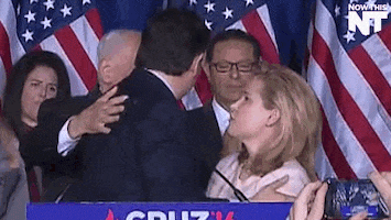 Ted Cruz ackwardly hugging wife and friend