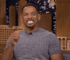 Celebrity gif. Will Smith bites his nails nervously then claps his hands in excitement.