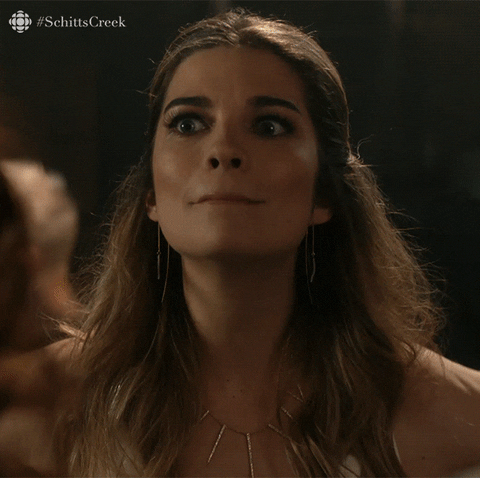 Schitt's Creek gif. Annie Murphy as Alexis is listening to someone's good news and reacting with an overdramatic, "Wow! Wow! Wowee!" She's shocked and trying to cover up her shock with overexcitement.