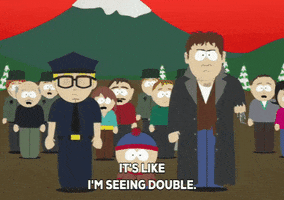 South Park gif. Standing at the front of a shocked crowd, Stan is at the center between a detective and a cop, who says, "It's like I'm seeing double," which appears as text.
