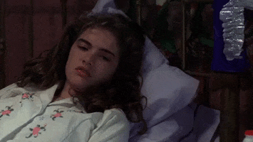 Movie gif. Heather Langenkamp as Nancy Thompson in A Nightmare on Elm Street struggling to resist sleep, nods off, waking herself up before her head hits the pillow.