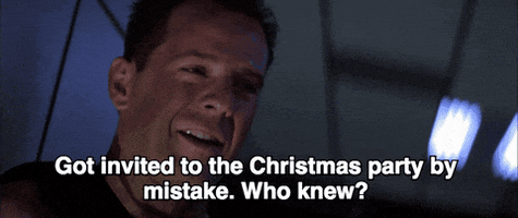 bruce willis got invited to the christmas party by mistake who knew GIF