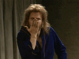 SNL gif. Will Ferrell wearing a bathrobe and a disheveled beard and wig. He leans forward toward us, blowing a kiss and pointing to his winking eye as he says, "Wink."
