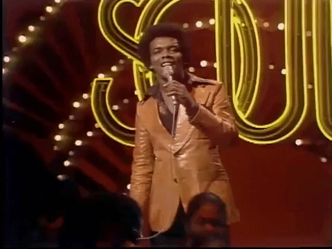 An animated gif of Johnny Nash singing Soultrain