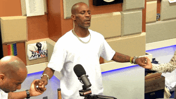 Celebrity gif. DMX holding hands and leading prayer on The Breakfast Club.