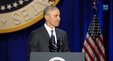 Politics gif. Barack Obama on stage behind a podium looking over to the side, straight-faced, points his finger and lowers his head with eyebrows raised.