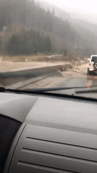 Water Pours Over Coquihalla Highway Divider Following Mudslide in British Columbia