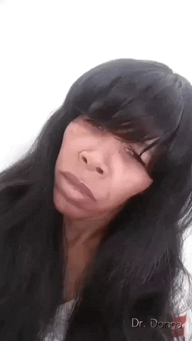 Video gif. Annoyed woman tilts her head, glaring at us as we zoom in and out on her face.