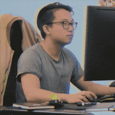 Video gif. A young man nods approvingly at his computer before turning to look at us. He gives us a satisfied purse of his lips and a thumbs up.