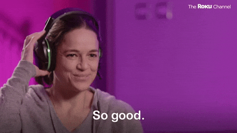 GIF of a lady wearing headphones saying "So good".