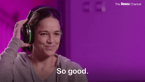 GIF of a lady wearing headphones saying "So good".