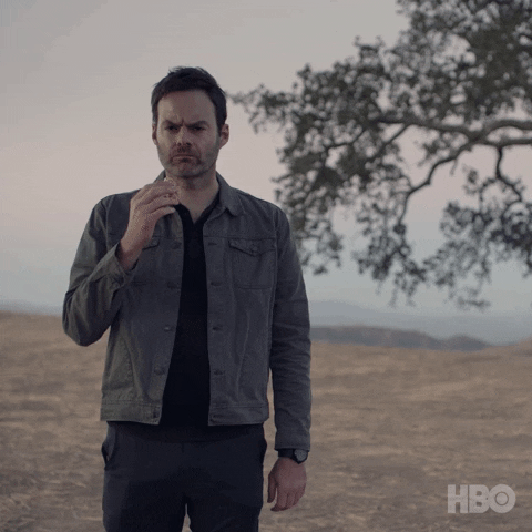 TV gif. Bill Hader as Barry, on Barry, takes a bite of a donut and chews slowly, pensively, in a foggy field.