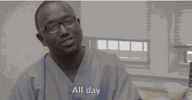 TV gif. Hannibal Buress as Lincoln on Broad City, dressed in scrubs with gloves, takes the hand of a patient and high-fives it, then bows his head as he holds up his fists, saying, "all day," which appears as text.