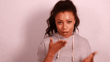 Celebrity gif. Actress Shalita Grant enthusiastically blows bunches of kisses with both hands. 