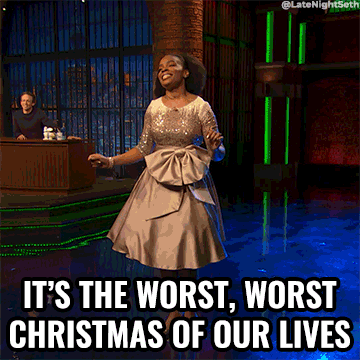 A gif of a woman in a beautiful dress, on stage, singing "It's the worst, worst Christmas of our lives"