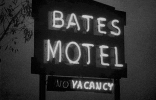 Movie gif. From Psycho, a shot of the neon-lit Bates Motel sign, with the word "vacancy" flashing on the "no vacancy" sign.