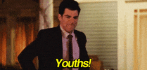 TV gif. Max Greenfield as Schmidt in the show New Girl looks annoyed, frustrated, with hands on his hips. Text, "Youths!"