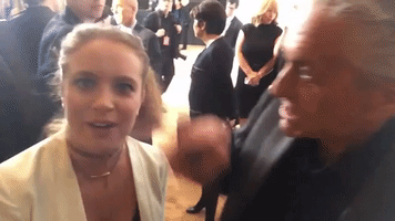 strippingdowncelebs michael douglas nose grab GIF