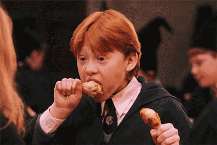 Ron Weasley eating chicken at the start of term feast