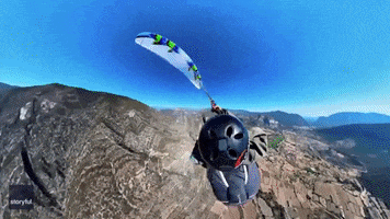Parachute Paragliding GIF by Storyful